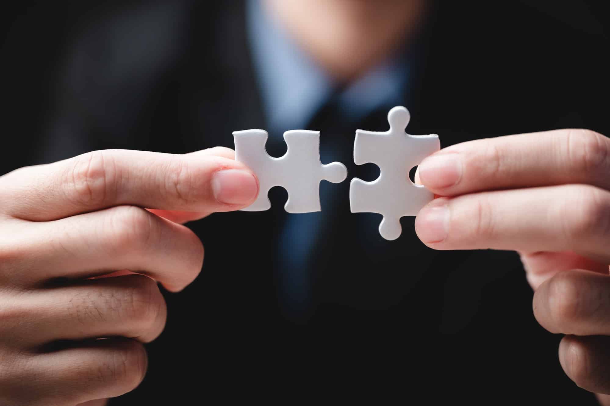 business success concept idea of jigsaw puzzle, teamwork solution and join connection
